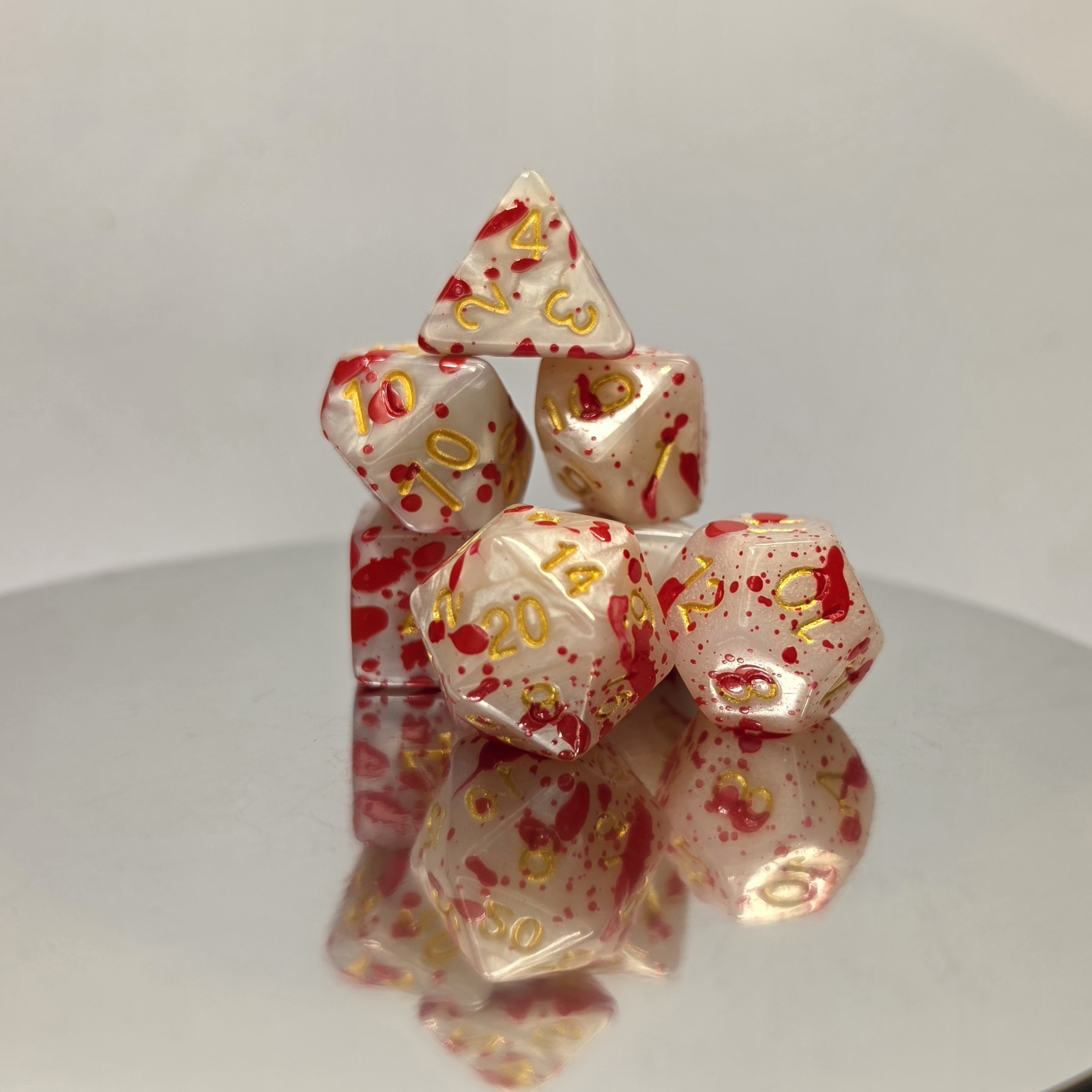 Blood Splatter Pearl Dice Set with Gold Embossed Numbers